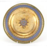 gilt copper and blue enamel wall hanging, with central star motif, probably Ottoman, 26cm in