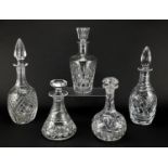 Five cut glass decanters including Tudor Royal Doulton and Royal Brierley, the largest 33cm high :