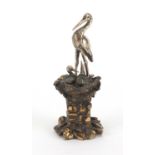 Unmarked silver and brass figure of a heron and chicks in a nest, 7cm high, approximate weight 34.5g