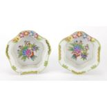 Pair of Herend of Hungary basket dishes, each with floral encrusted rims and hand painted with