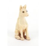 Japanese carved ivory netsuke of a seated dog, character marks to the reverse, 4.5cm high : For