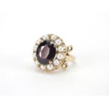 9ct gold garnet and pearl ring, size P, approximate weight 7.5g : For further Condition Reports