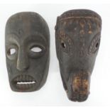 Two African tribal carved wooden face masks, one of an elephant, the largest 29cm high : For further