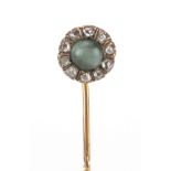 Victorian unmarked gold green tigers eye and diamond tie pin, housed in a Clark tooled leather