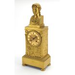 19th century French Ormolu mantel clock, with Roman bust above a library bookcase on turned feet,