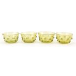 Four Arts & Crafts green glass finger bowls, each 13.5cm in diameter : For further Condition Reports