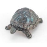 Silver filled model of a tortoise, indistinct hallmarks to the underside, 5cm in length, approximate