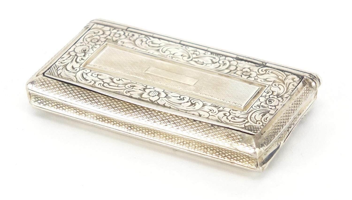 Rectangular continental silver snuff box with engine turned decoration, the hinged lid engraved with