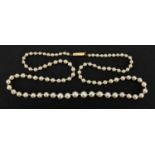 Single string pearl necklace with unmarked gold clasp, 44cm in length, approximate weight 8.8g : For