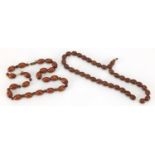 Two Islamic Koka prayer bead necklaces, the largest 47cm in length : For further Condition Reports