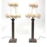 Pair of silvered Corinthian column table lamps, each with silk lined feather shades, each 77cm