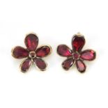 Pair of 9ct gold garnet flower head earrings, with screw backs, housed in a Dibdin & Co Limited