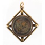 Victorian gold coloured metal compass fob set with a hard stone, 2.5cm x 2.5cm, approximate weight