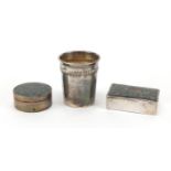 Silver objects, two pill boxes with enamelled lids and a continental beaker, the largest 4cm high,