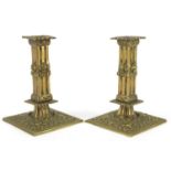 Pair of classical brass candlesticks, cast with putti amongst foliage, 18.5cm high : For further