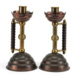 Pair of Arts & Crafts copper and brass candlesticks probably Benham and Froud, designed by