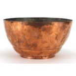 Artificers Guild hand beaten copper bowl, impressed marks to the base, 13.5cm high x 26cm in