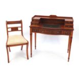 Inlaid yew ladies writing desk with tooled leather insert and an arrangement of seven drawers