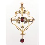 Art Nouveau 9ct gold garnet and seed pearl pendant brooch, 5cm in length, approximate weight 3.