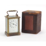 Brass cased carriage clock by W Bruford & Son, with velvet lined travelling case, 11cm high