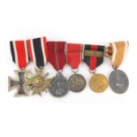 German Military interest medal group including two crosses, one with swords : For extra condition