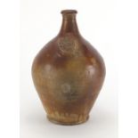 Large 17th/18th century salt glazed Bellarmine jug, with impressed crest, 36cm high : For extra