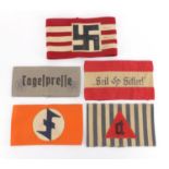 Five German Military interest arm bands including Tagelprelle design and Heil Hitler design examples