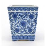 Chinese blue and white porcelain four footed square planter of tapering form, hand painted with