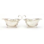 Pair of silver three footed sauce boats, B & B London 1936, 14.5cm in length, approximate weight