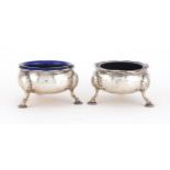 Pair of Victorian circular silver salts, with hoof feet and blue glass liners, MWC London 1870,