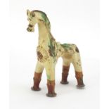 Antique Turkish Canakkale pottery vessel in the form of a horse with splashes of green paint, 22cm