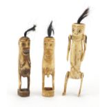 Three Tribal bone fertility figures, one with articulated limbs, the largest 13.5cm in length :