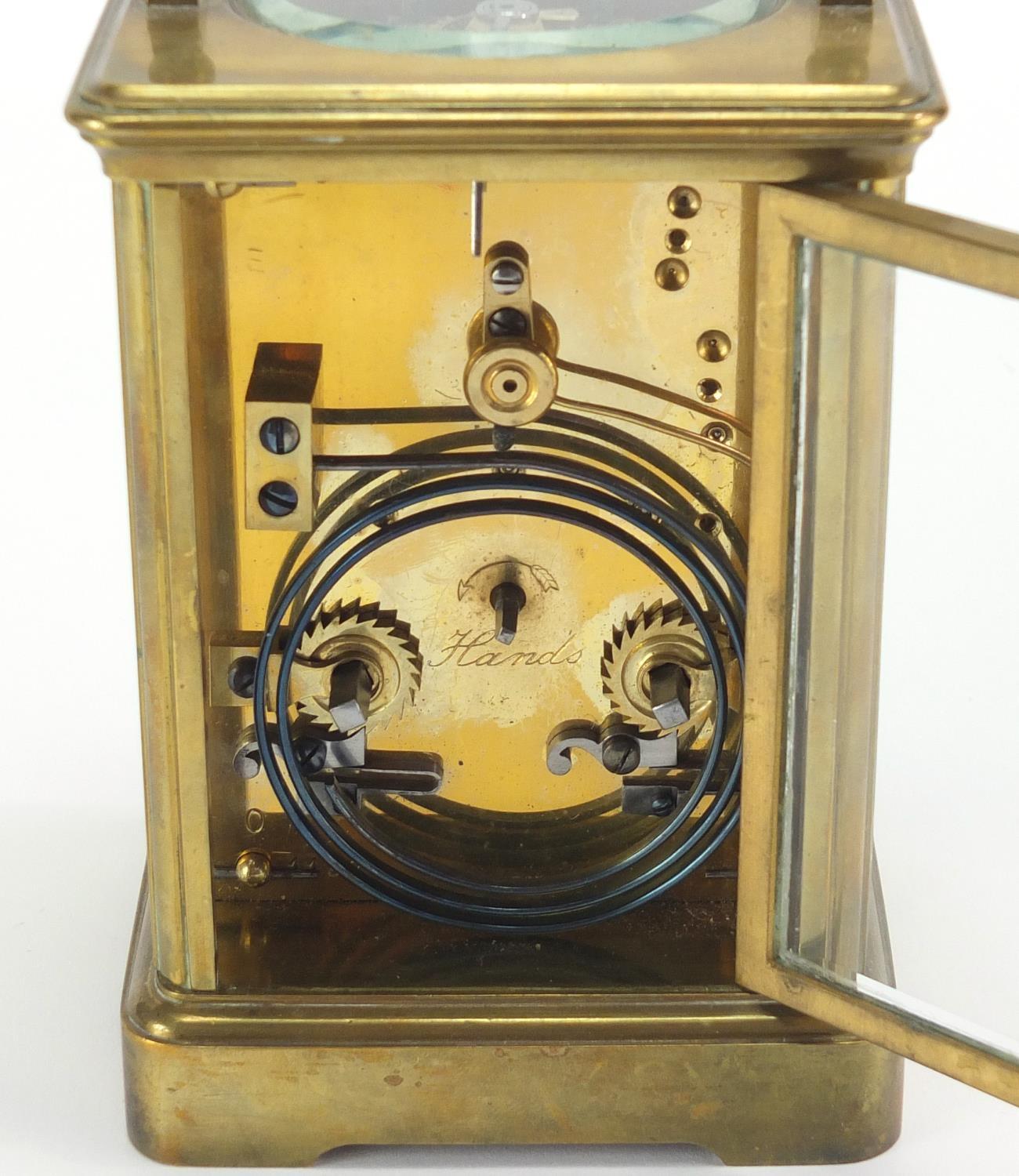 Brass cased carriage clock by Goldsmiths Company London and Paris, with enamelled dial and Roman - Image 5 of 6