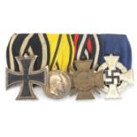 German Military interest medal group including three crosses, one with sword : For extra condition