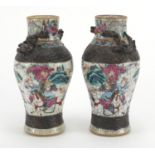 Pair of Chinese crackle glazed vases, with relief dragon decoration, each hand painted with the