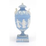 Wedgwood Jasperware urn vase and cover, with twin handles, decorated in low relief with a continuous