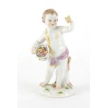 19th century Meissen porcelain figure of a cupid holding a basket of flowers, blue cross sword marks