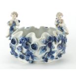 Sitzendorf hand painted porcelain floral encrusted Myth of Blue Rose bowl with two putti, factory