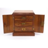 Victorian walnut specimen chest with a pair of doors enclosing three drawers with inset brass