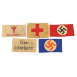 Five German Military interest arm bands including Lager Dolmetscher design and Sanitätsdienst design