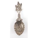 Continental silver caddy spoon, with dolphin handle, the bowl embossed with a maid, 925 import