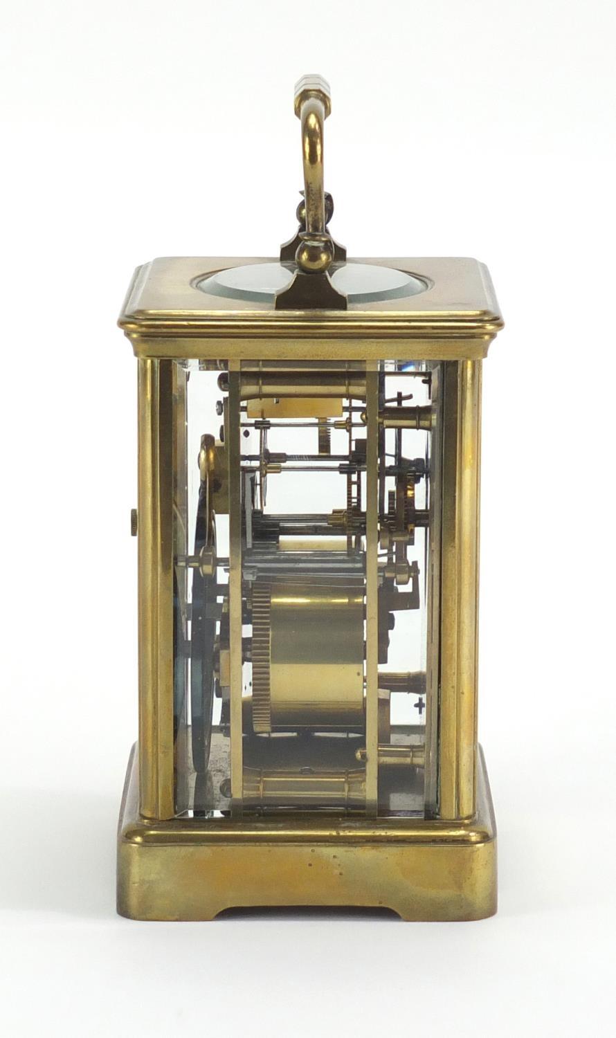 Brass cased carriage clock by Goldsmiths Company London and Paris, with enamelled dial and Roman - Image 6 of 6