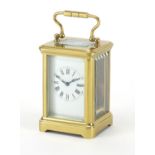 Miniature French brass cased carriage clock by R & Co of Paris, with enamelled dial and Roman
