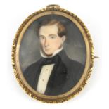 19th century oval hand painted portrait miniature of a young gentleman in formal dress, housed in