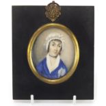 19th century oval hand painted portrait miniature of a female wearing a bonnet, housed in a