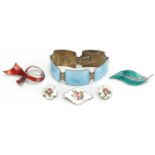 Silver and enamel jewellery including two Norwegian brooches and a long boat bracelet, the largest