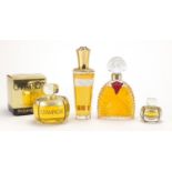 Four vintage shop facet dummy perfume bottles, two Yves Saint Laurent, Madame Rochas and Ungaro Diva