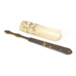 Japanese ivory wrist rest, finely carved with birds of Paradise, together with a bronze and mixed