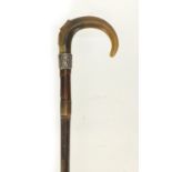 Horn handled walking stick with silver collar and brass ferrule, possibly rhino horn, 91cm in length