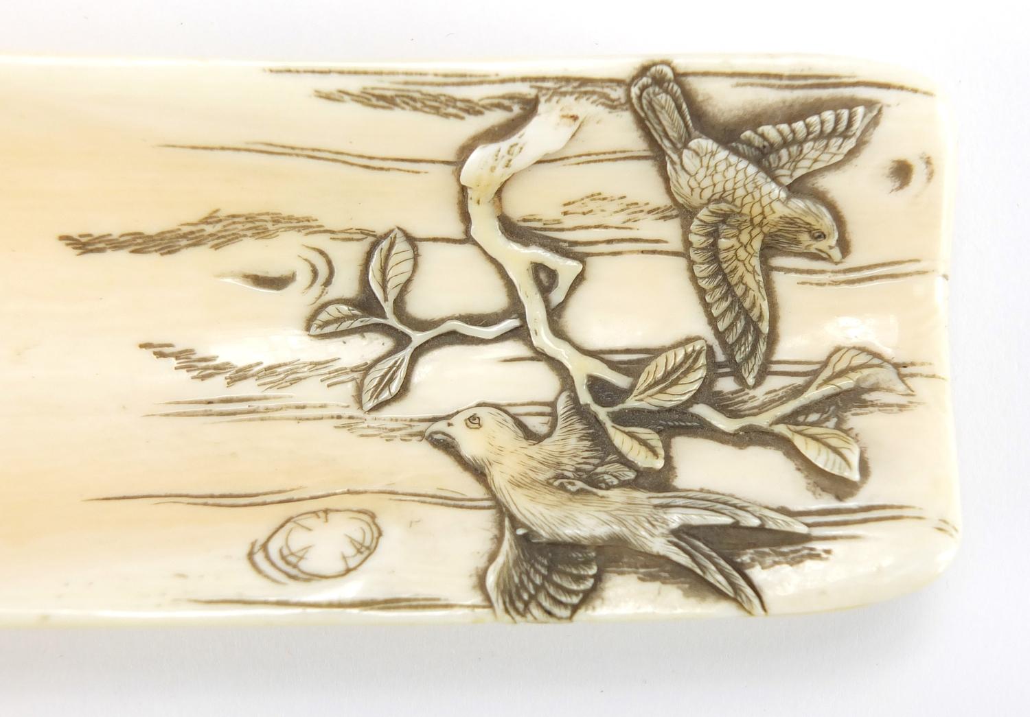 Japanese ivory wrist rest, finely carved with birds of Paradise, together with a bronze and mixed - Image 4 of 6